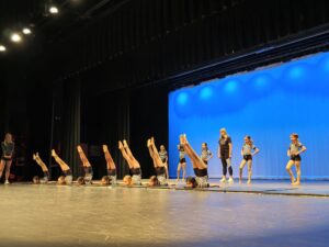 Acro dance students set up during dress rehearsal.